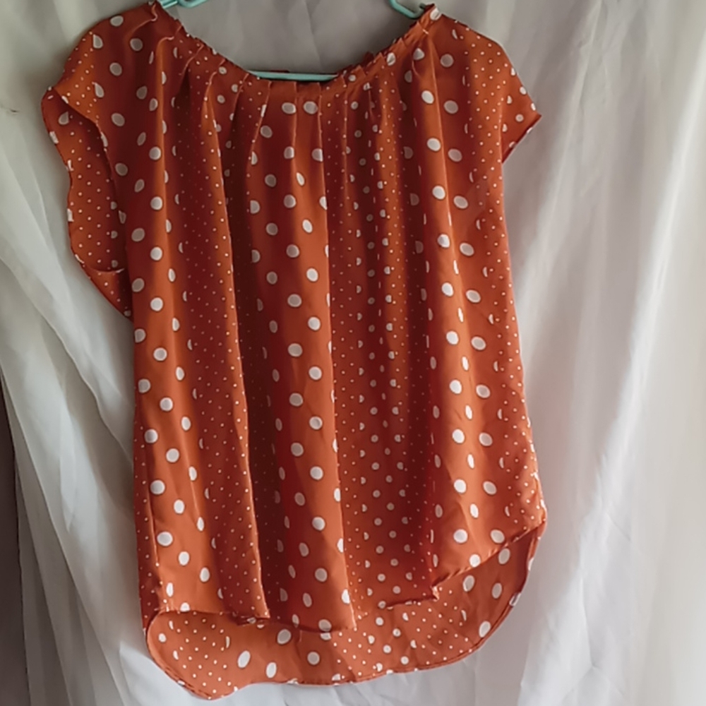 Pumpkin and polka dot bow tie back blouse